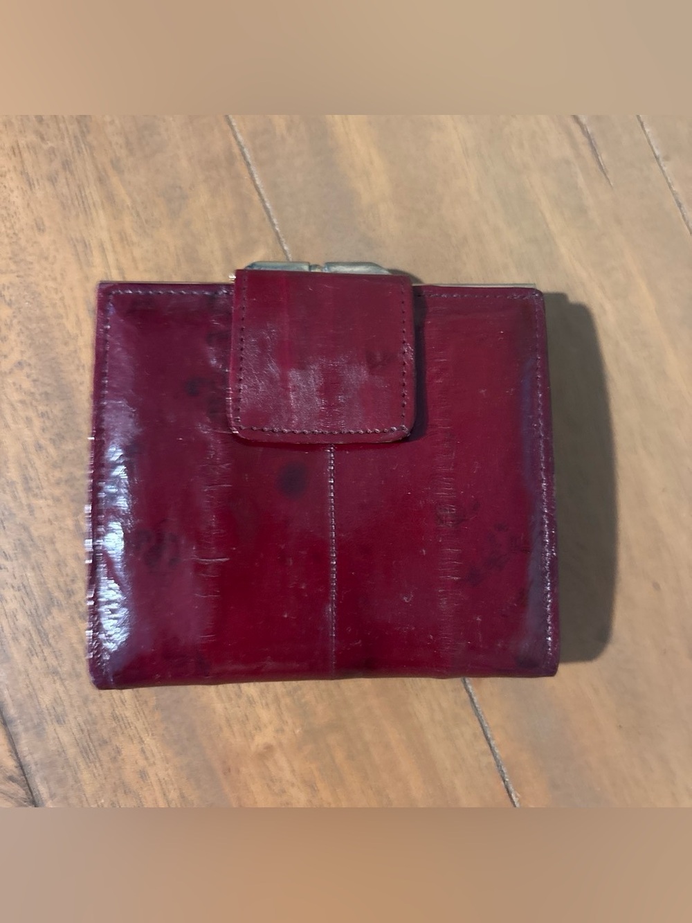 Vintage Eel skin Burgundy mini change purse. Gold tone snaps and trim